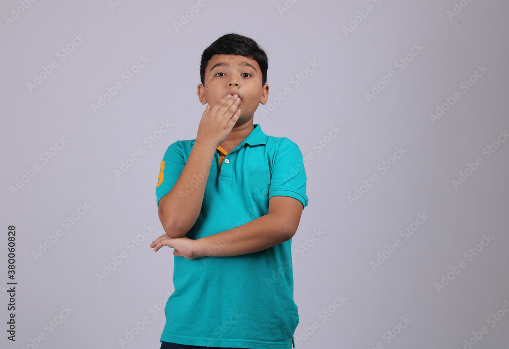 Boy with a shocked face expression. Isolated over white background. Boy with a shocked face expression. Isolated over white background.