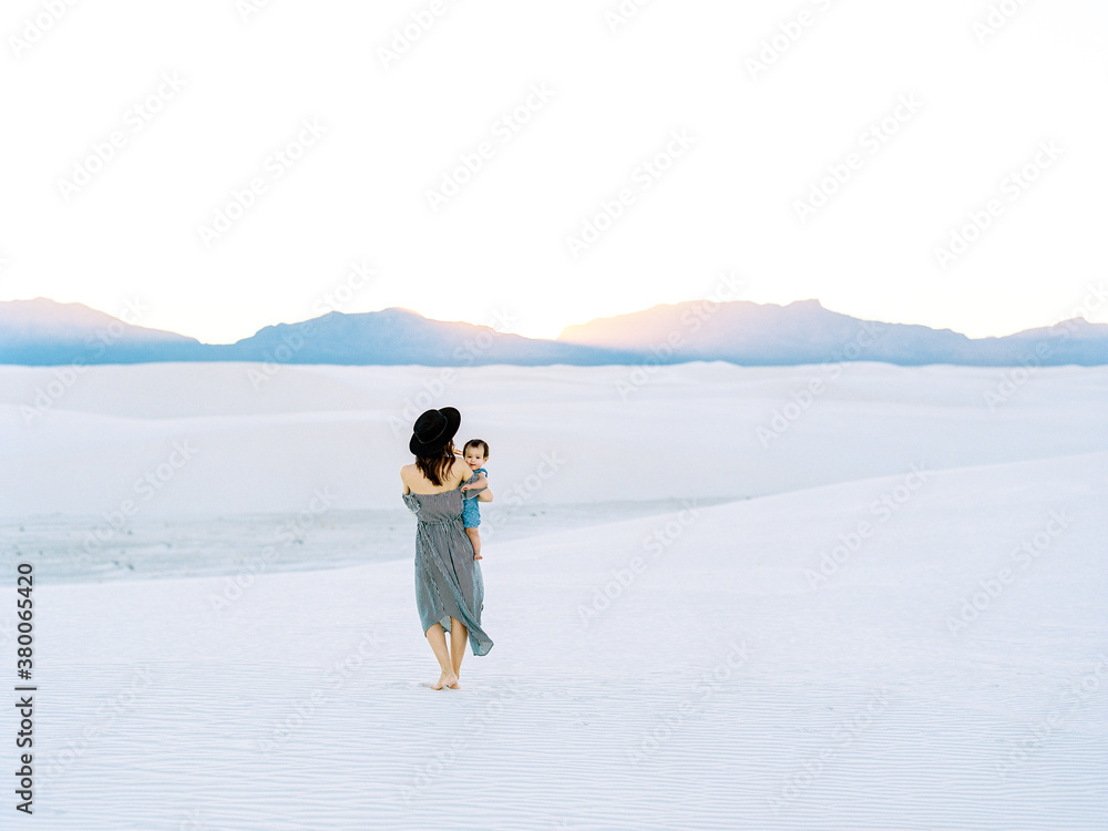 Mom holding baby in White Sands National Park Mom holding baby in White Sands National Park