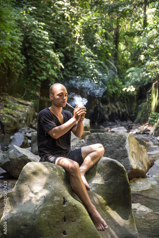 Man performing RapÔøΩÔøΩ in the jungle Man performing RapÔøΩÔøΩ in the jungle