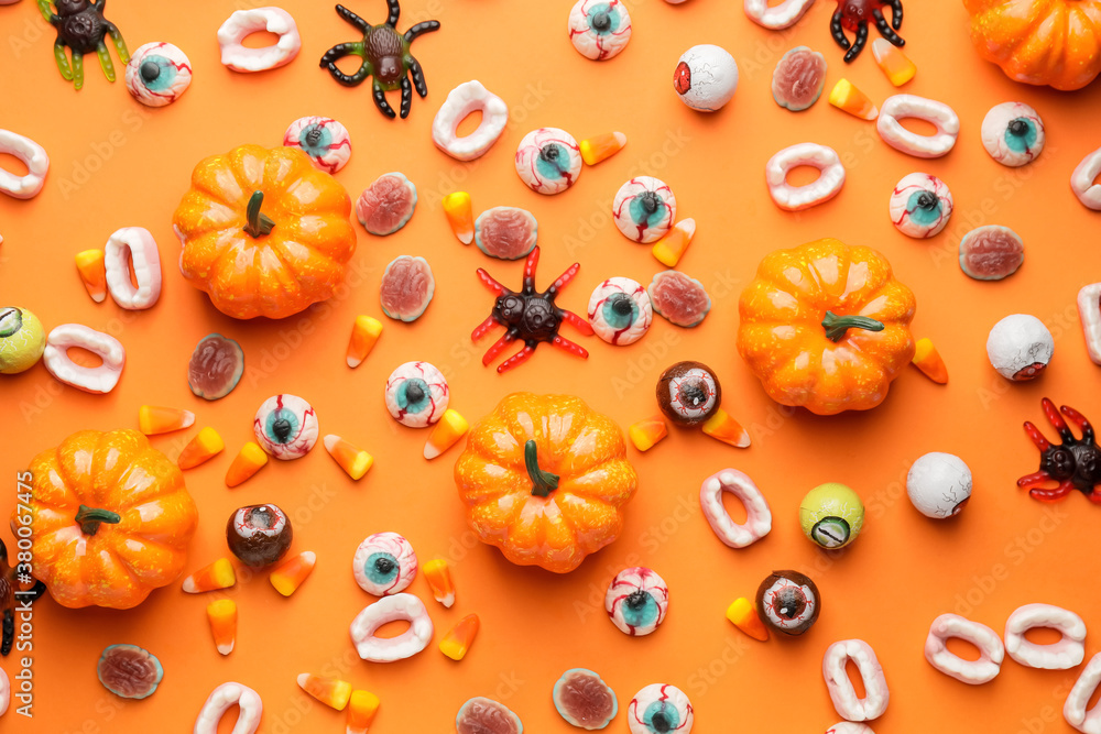 Halloween composition with tasty treats on color background Halloween composition with tasty treats on color background