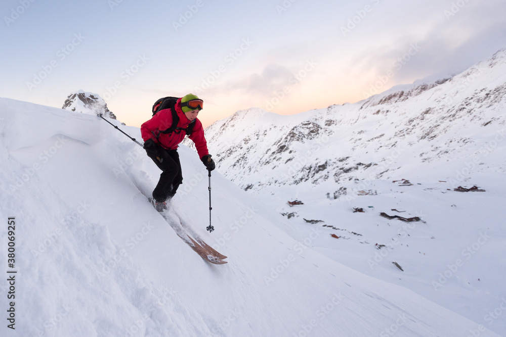 Caucasian woman skiing downhill a steep ski slope Caucasian woman skiing downhill a steep ski slope
