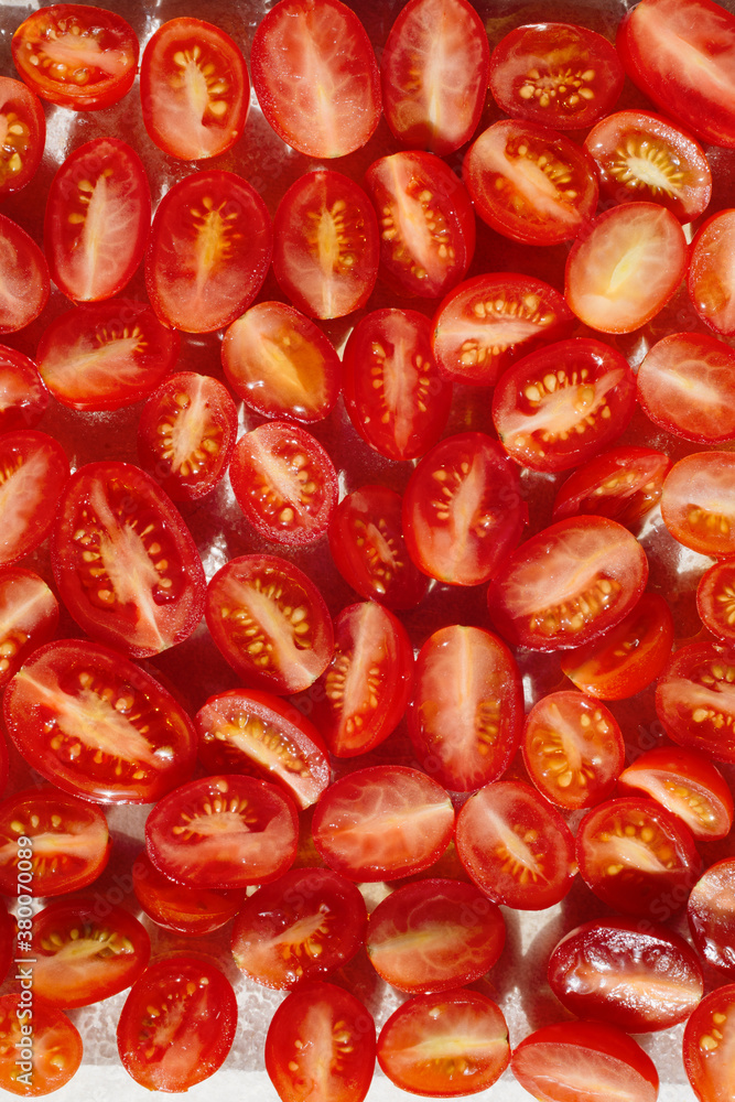 Sliced cherry tomatoes with salt Sliced cherry tomatoes with salt