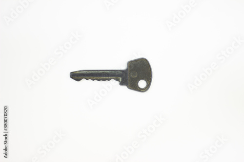 Ancient keys, used for long time. Vintage key on white background. Old key isolated. Keys on table. 