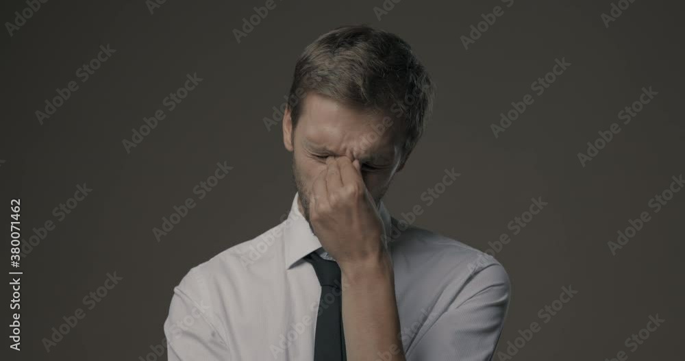Stressed businessman with headache Stressed businessman with headache