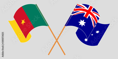 Crossed and waving flags of Cameroon and Australia