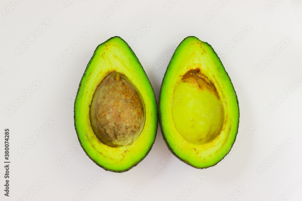 Open avocado on a white background. Avocado macro. Close up of an avacado. Avocado isolated on white background.