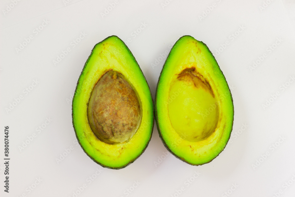 Open avocado on a white background. Avocado macro. Close up of an avacado. Avocado isolated on white background.