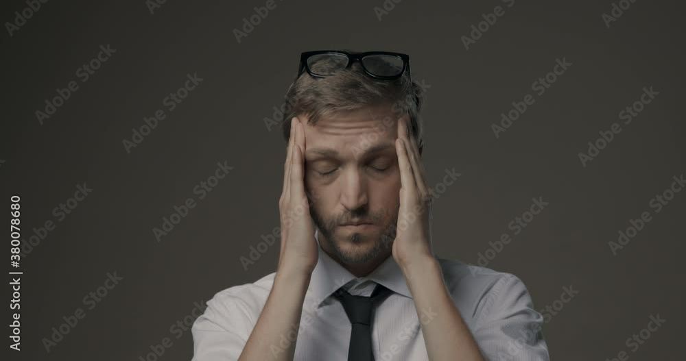 Stressed businessman with headache Stressed businessman with headache