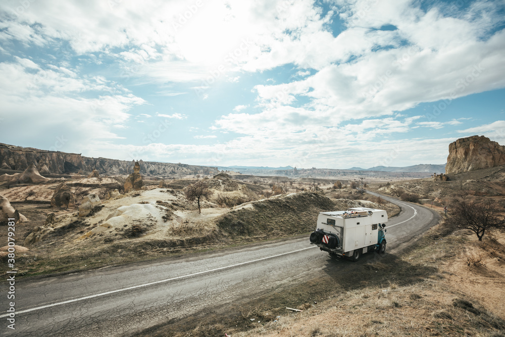 camping truck on a road leading through cappadocia, turkey camping truck on a road leading through cappadocia, turkey