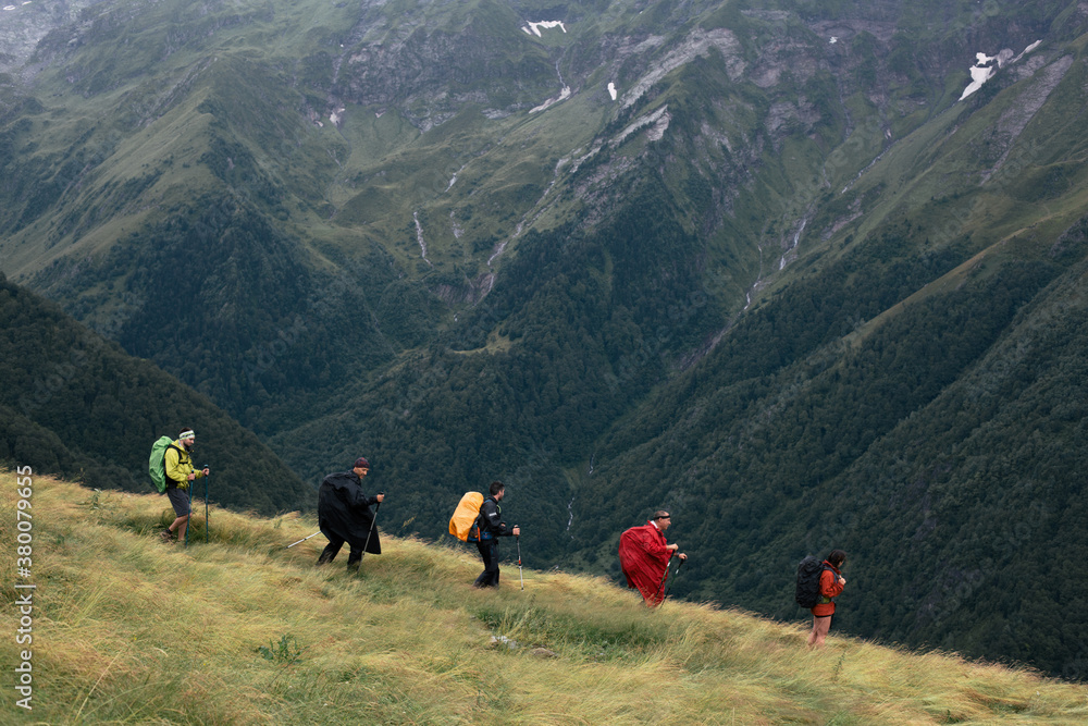 Happy backpackers on a rainy day Happy backpackers on a rainy day