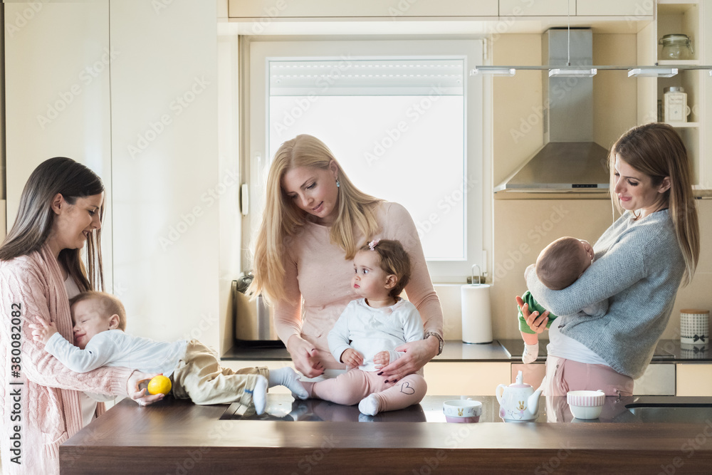 Moms spend time together with their babies. Moms spend time together with their babies.