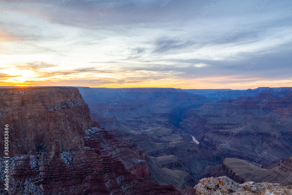 Scenic landscape view from Grand Canyon’s South Rim in winter during dramatic sunset
