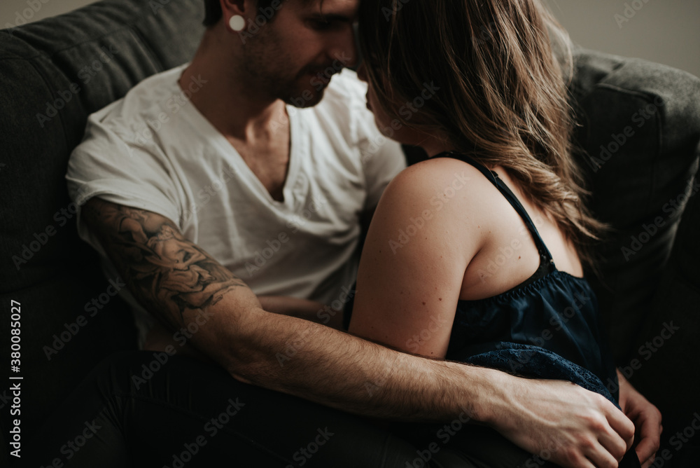 Young couple hanging out in living room apartment Young couple hanging out in living room apartment