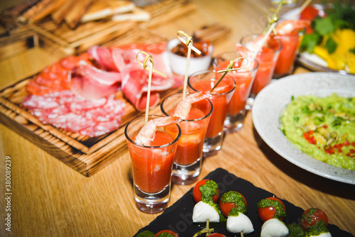 shrimp on a skewer with tomato juice. snacks catering