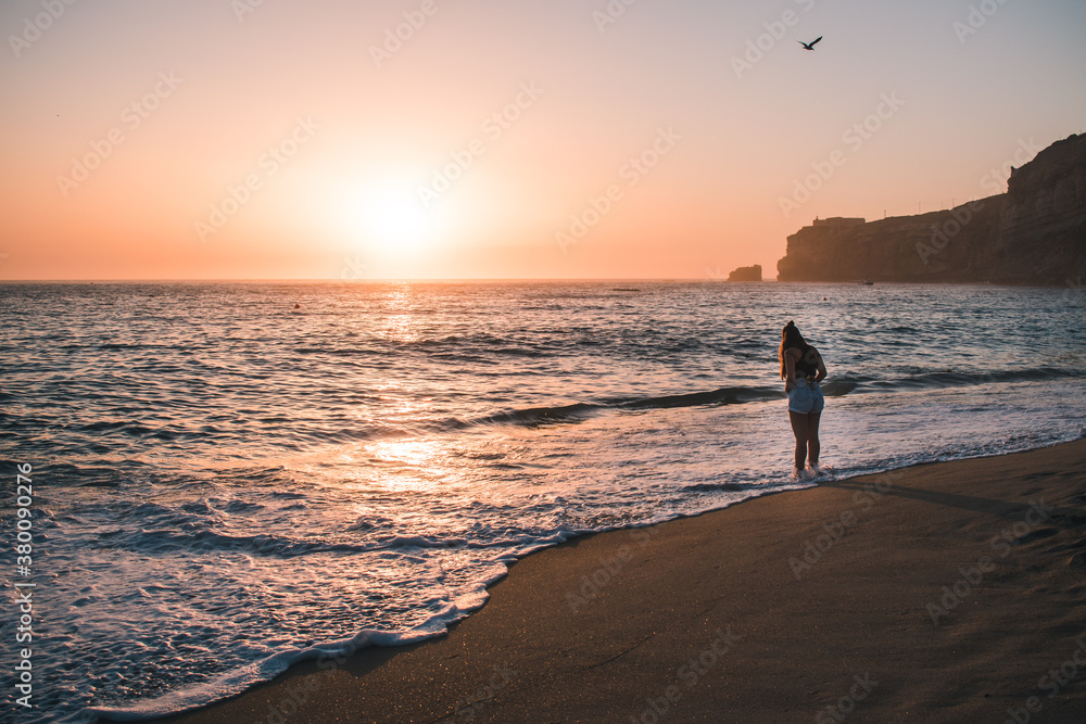 Fototapeta premium Nazaré Beach with girl