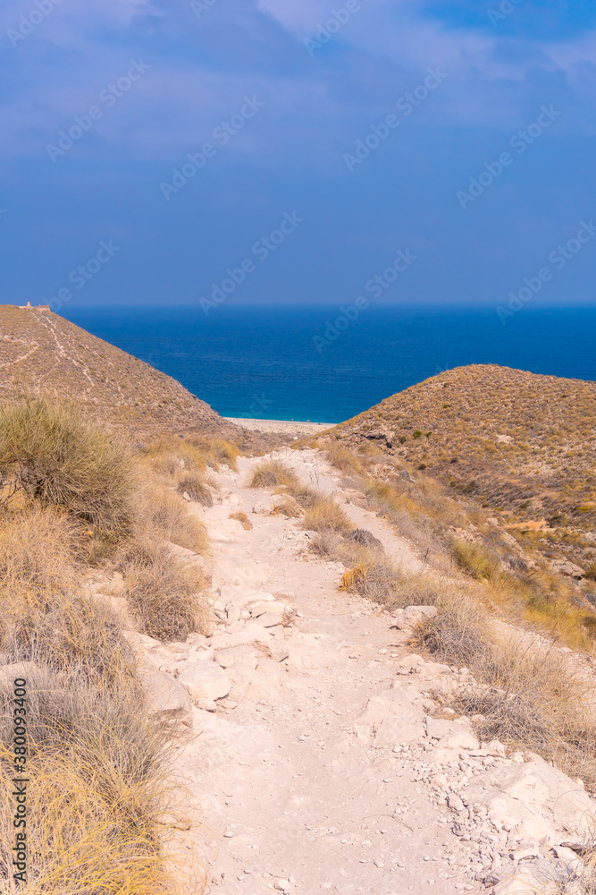 Trail down to La Playa de los Muertos in the natural park of Cabo de Gata, Nijar, Andalucia. Spain