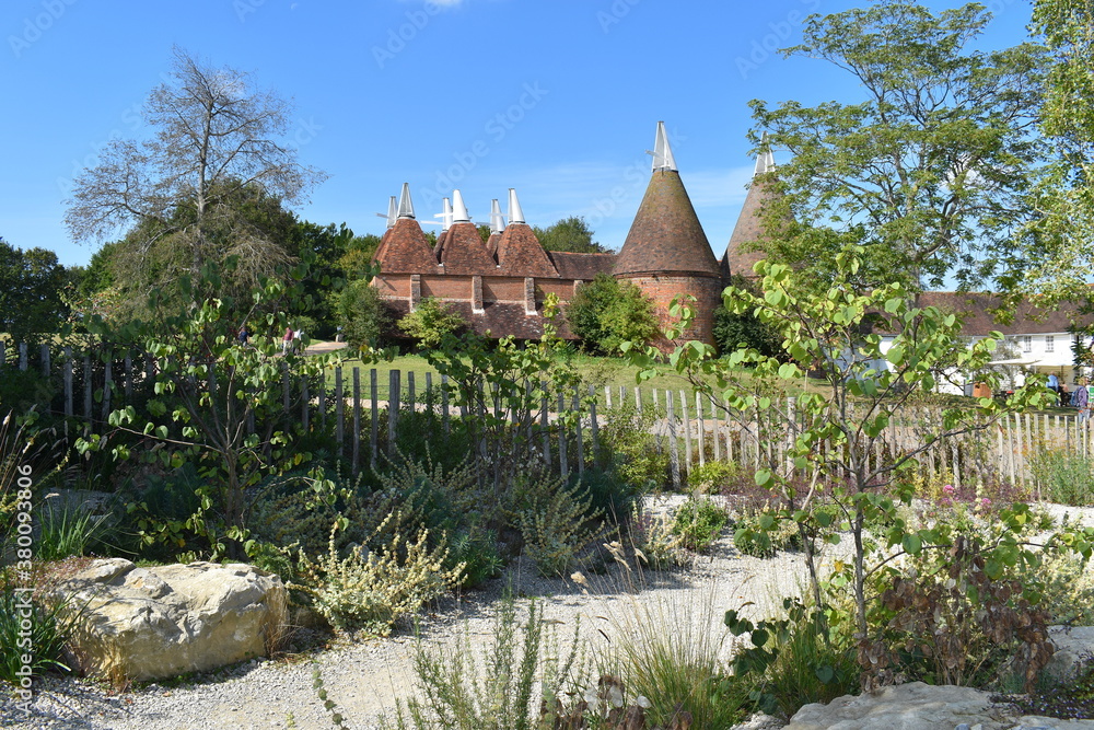 An oast house seen in Kent is a building designed for drying hops as part of the brewing process They can be found in most and former hop-growing areas and are good examples of vernacular architecture