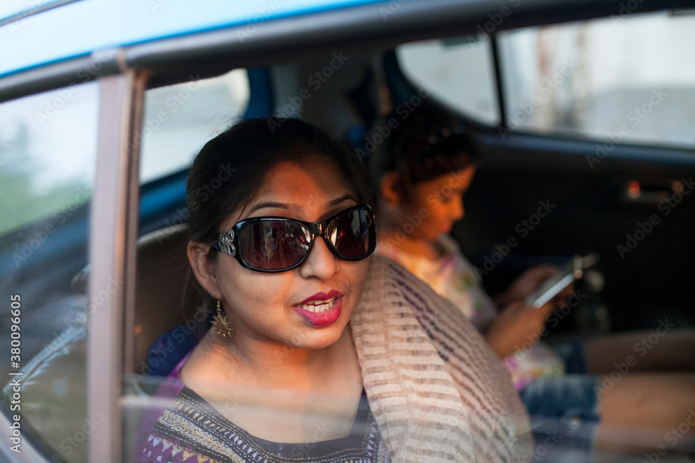 woman wearing sunglasses looking at camera woman wearing sunglasses looking at camera