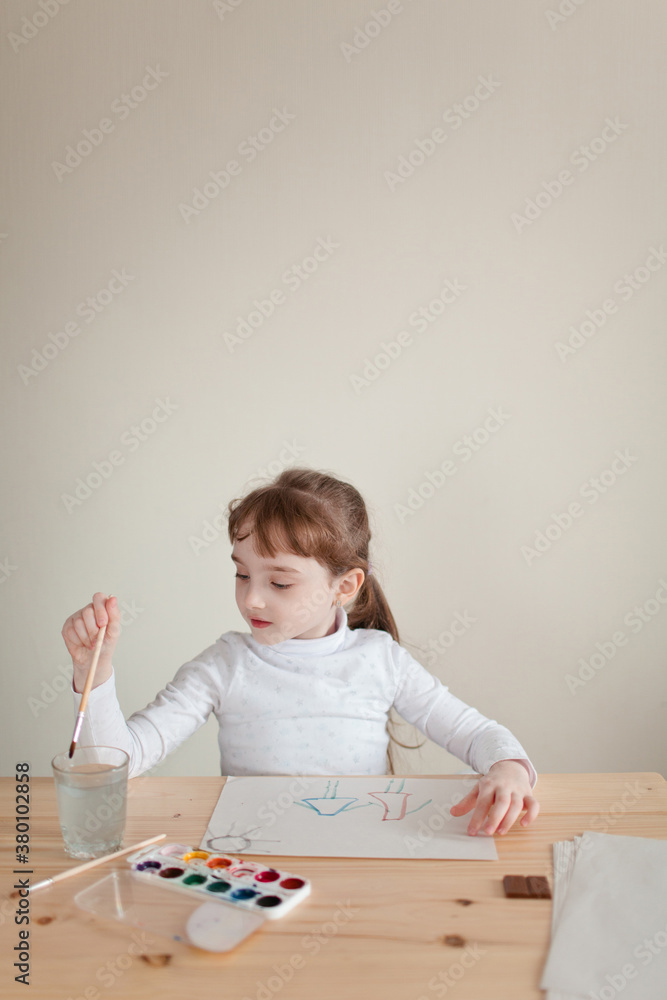 Little girl doing painting with watercolor Little girl doing painting with watercolor