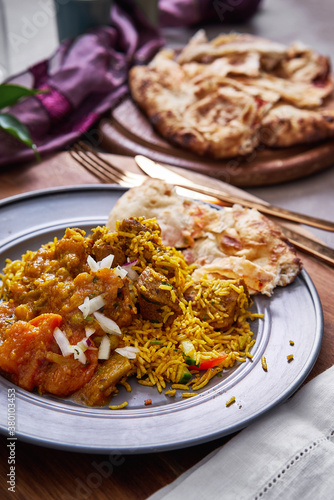 Lamb biryani with keema naan bread. photo