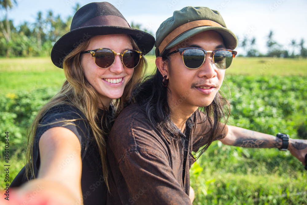 Young couple traveling by motorcycle - taking a selfie Young couple traveling by motorcycle - taking a selfie