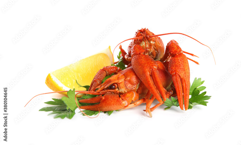 Delicious red boiled crayfishes with lemon and parsley isolated on white Delicious red boiled crayfishes with lemon and parsley isolated on white