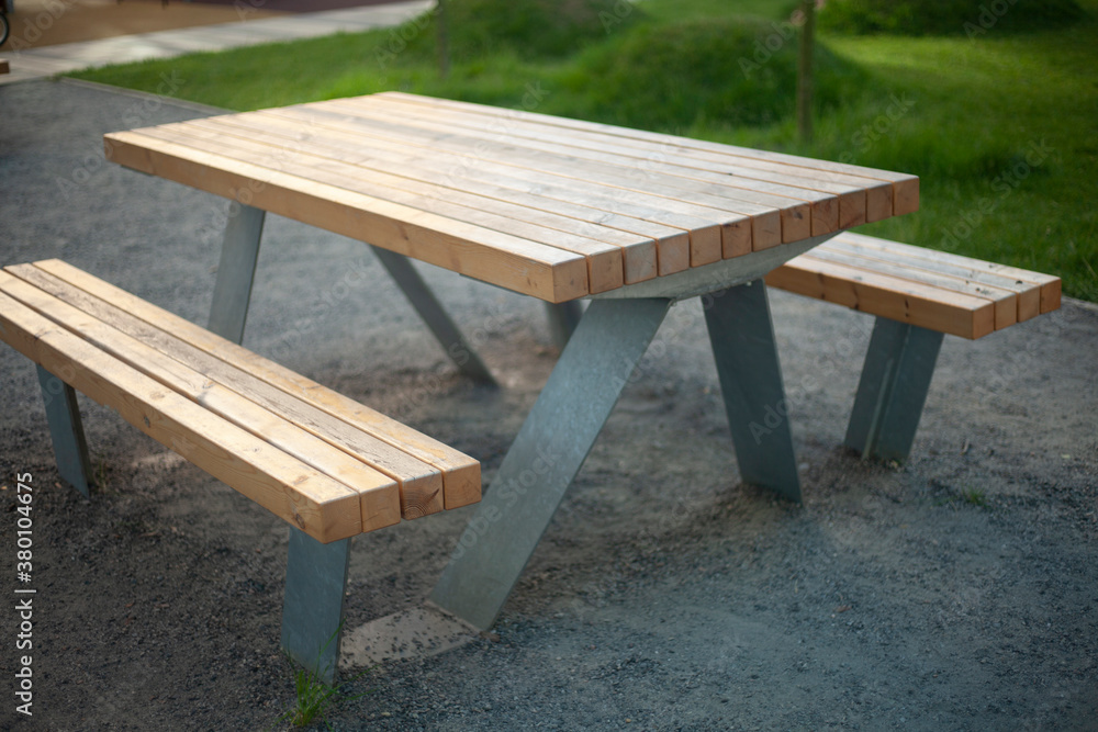 The table is outside. A table in the park