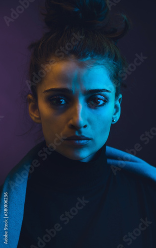 Portrait of young female/neon lgihts. photo