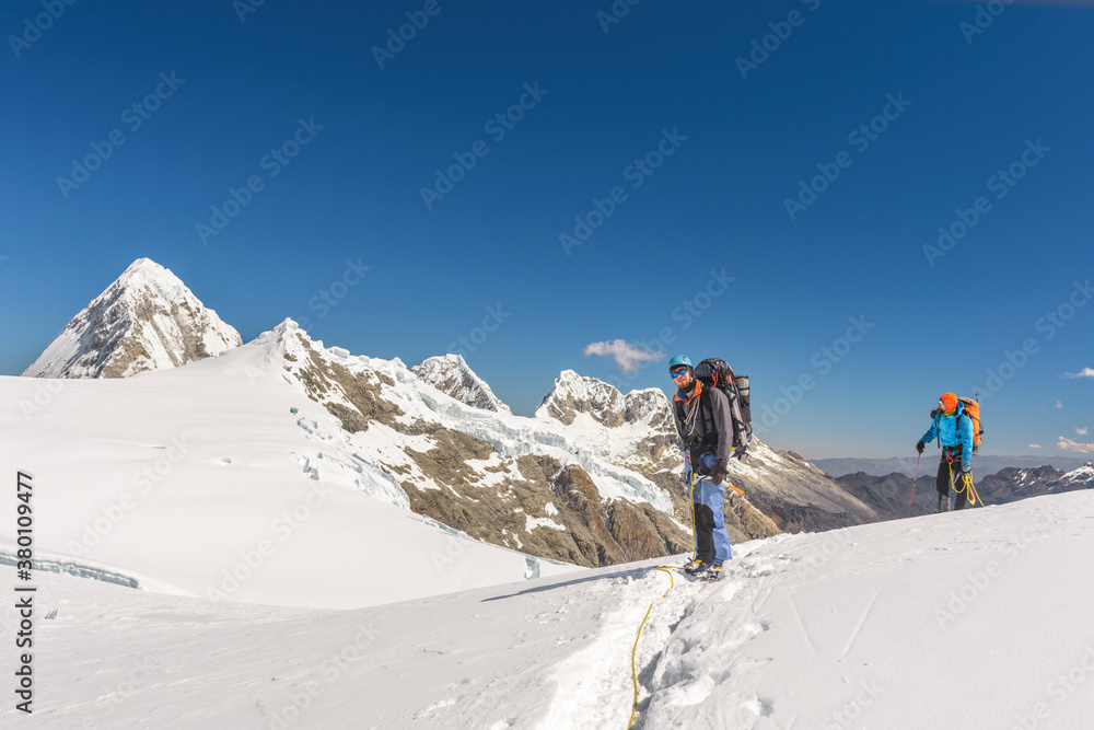 Mountaineers on snow-capped mountain plateau in Cordillera Blanc Mountaineers on snow-capped mountain plateau in Cordillera Blanc