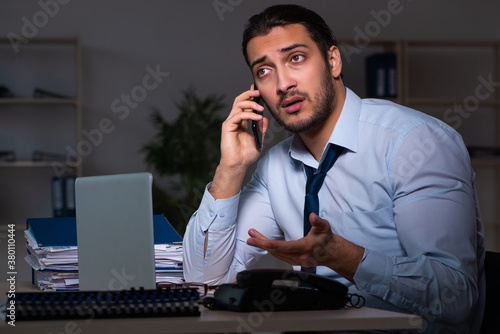 Young businessman working late in the office