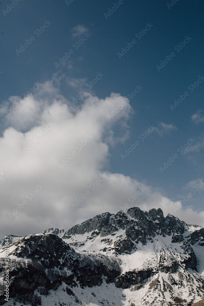 Rocky mountain peak covered with snow Rocky mountain peak covered with snow