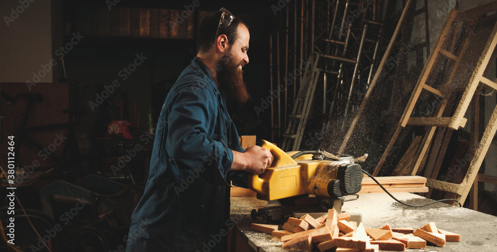 Carpenters working in workshop/sawmil with wood on circular saw. Carpenters working in workshop/sawmil with wood on circular saw.