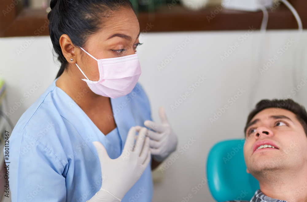 Dentist explaining her opinion on a treatment Dentist explaining her opinion on a treatment