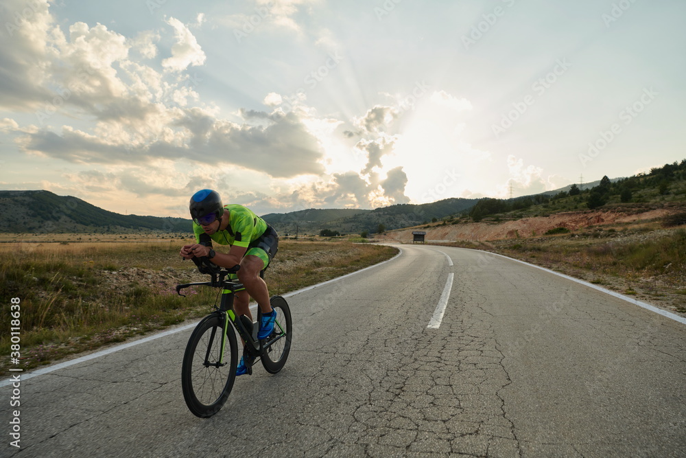 triathlon athlete riding bike triathlon athlete riding bike