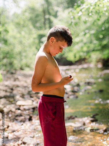 Young boy Looking for rocks