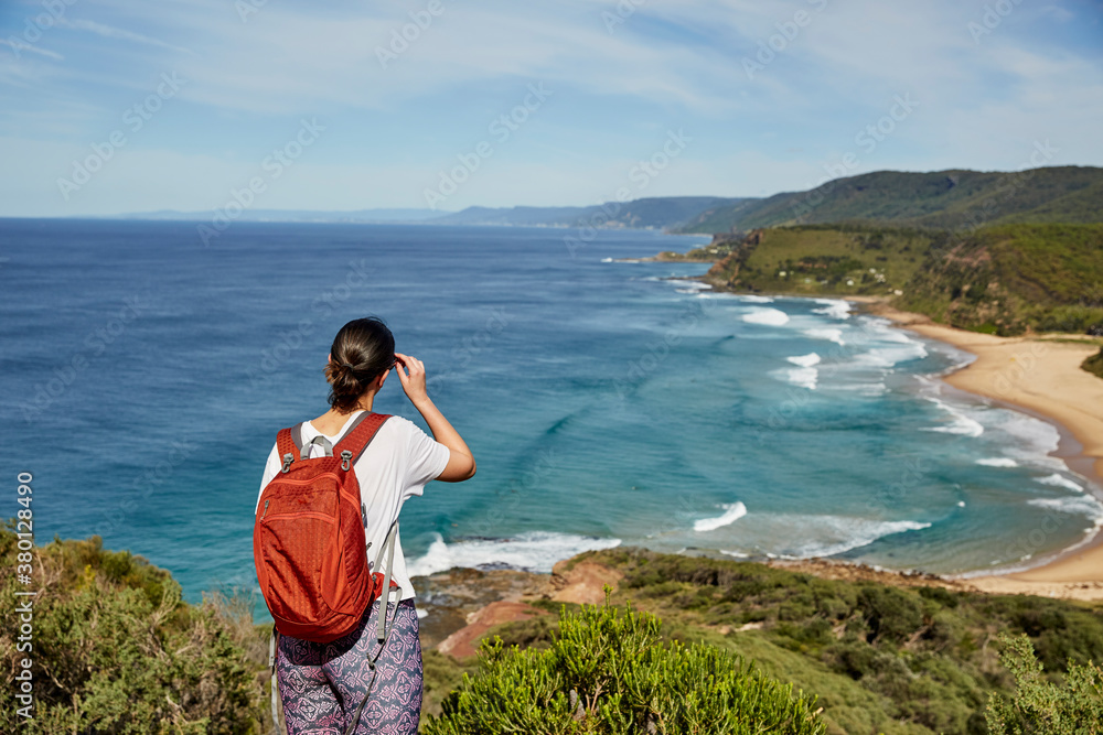 A female hiker stopped to admire the view A female hiker stopped to admire the view