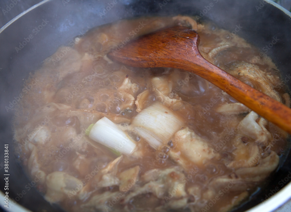 Stewed fish cubes in iron pan with miso Stewed fish cubes in iron pan with miso