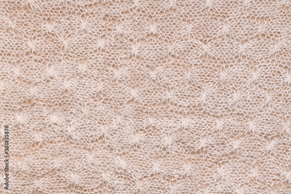 Horizontal knitted background with a recurring homogeneous pattern. Horizontal knitted background with a recurring homogeneous pattern.