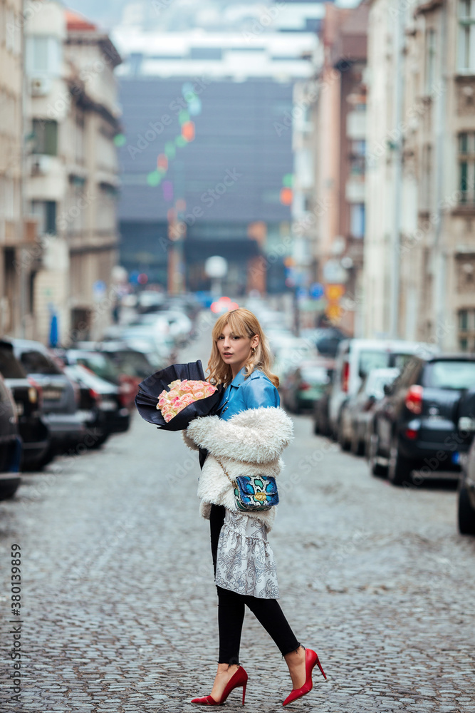 Woman with a bouquet of roses on ValentineÔøΩ_s Day Woman with a bouquet of roses on ValentineÔøΩ_s Day