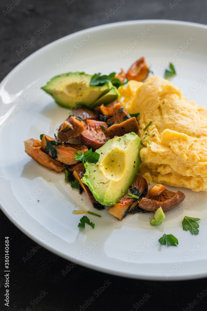 breakfast of scrambled egg with foraged pine mushrooms and avoca breakfast of scrambled egg with foraged pine mushrooms and avoca