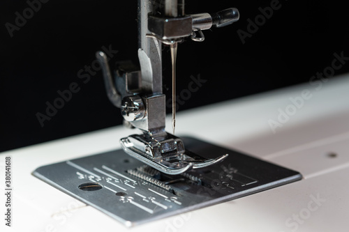  Close up photo of a modern sewing machine Presser Foot with a needle