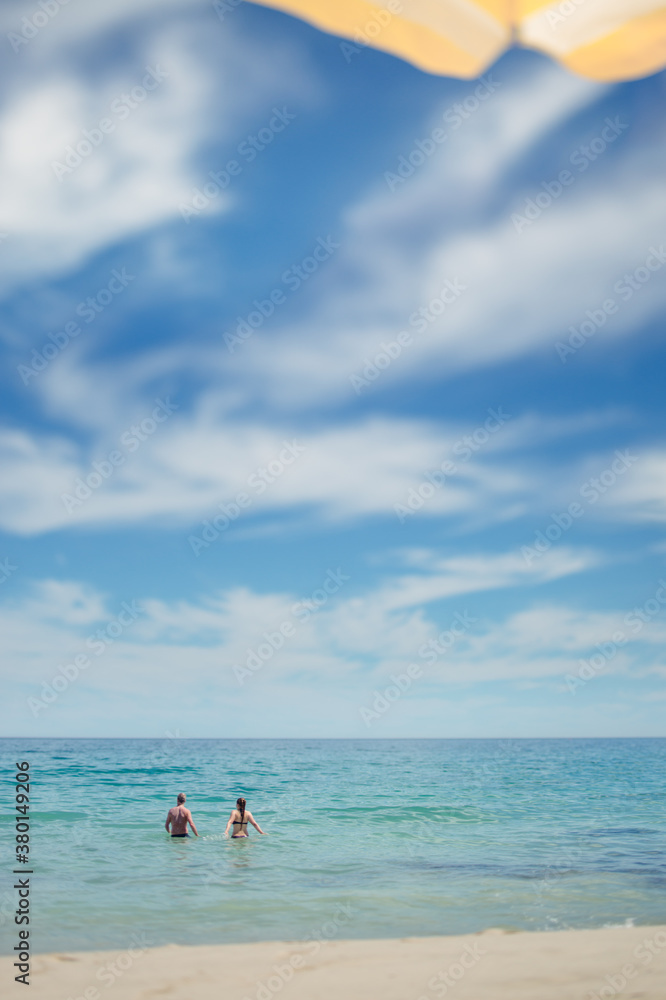Father and child swimming in the ocean Father and child swimming in the ocean