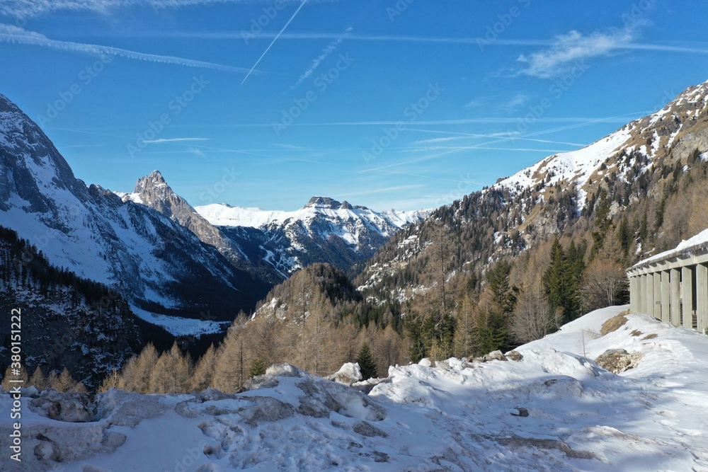 aerial snow covered mountain peaks in alps at winter 