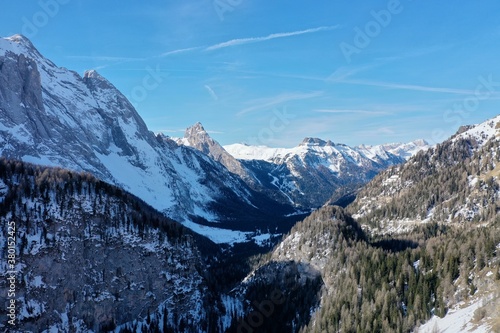 aerial snow covered mountain peaks in alps at winter 