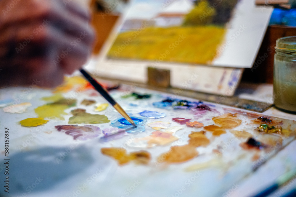Artist working on a oil painting Artist working on a oil painting