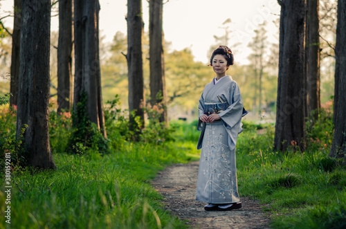 Lady In Kimono On Wooded Path photo