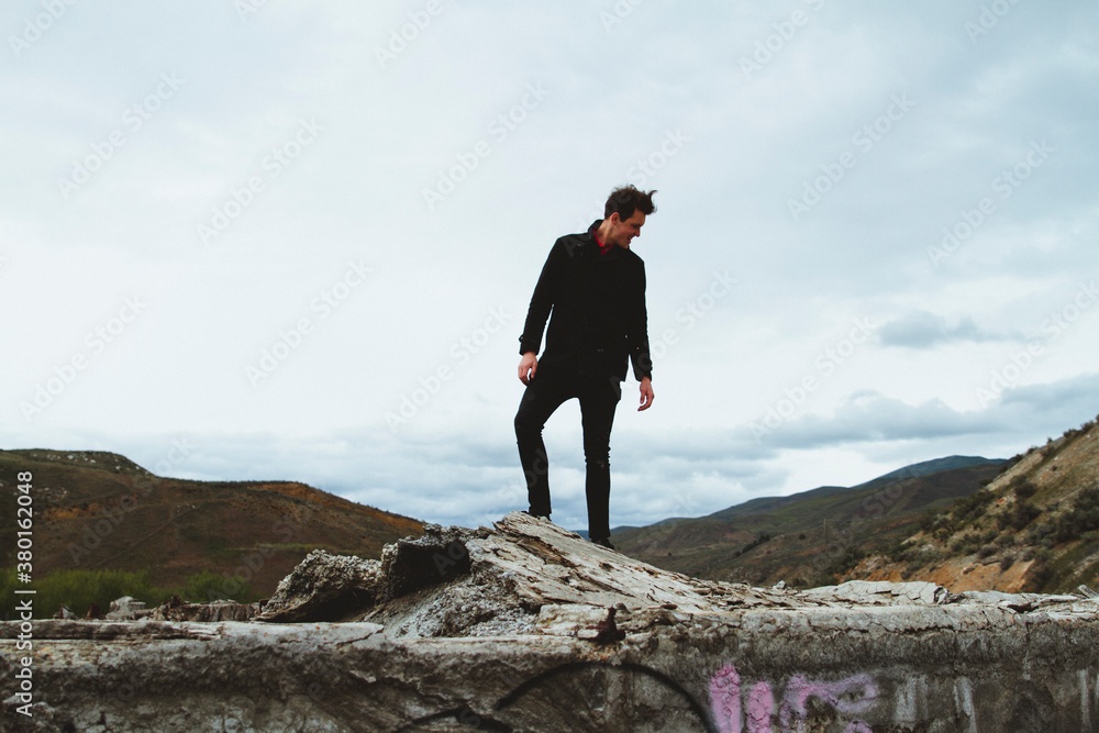 Young man in abandoned building