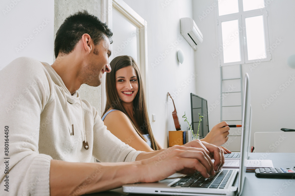 Young Couple Working at Home Young Couple Working at Home