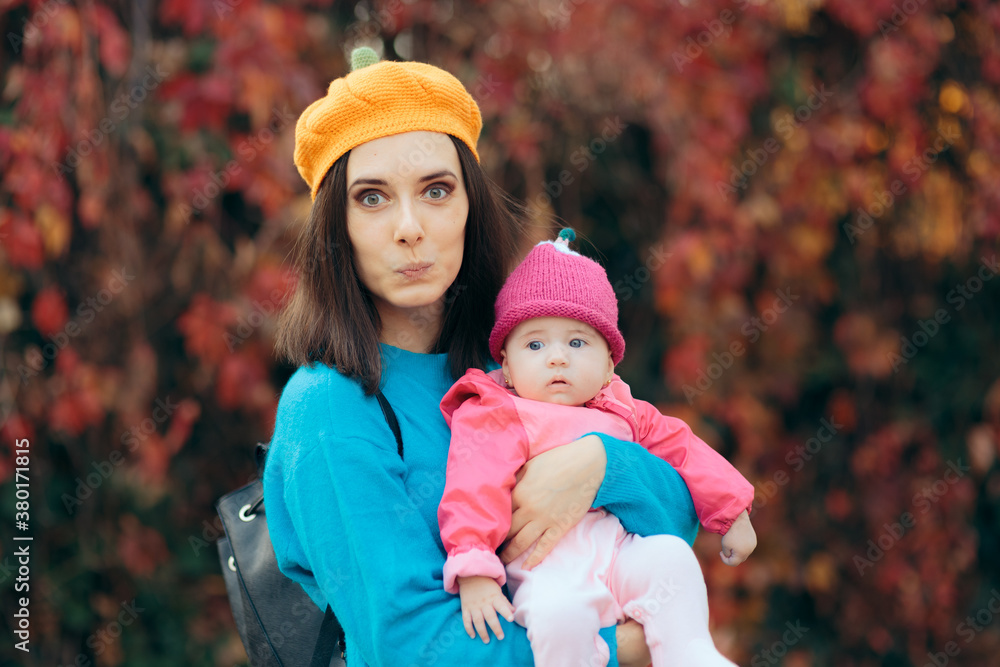Portrait of a Cute Mother and Child Wearing Knitted Hats Portrait of a Cute Mother and Child Wearing Knitted Hats