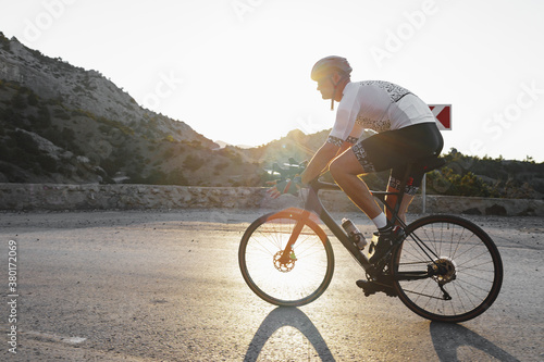 Professional road bicycle racer in action on mountain road